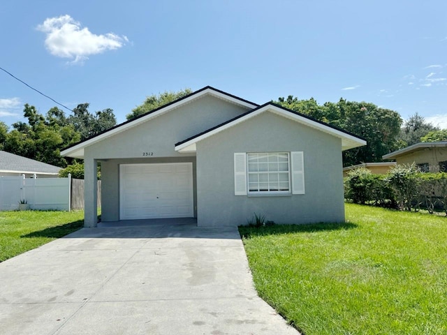 view of front of property featuring a garage and a front lawn