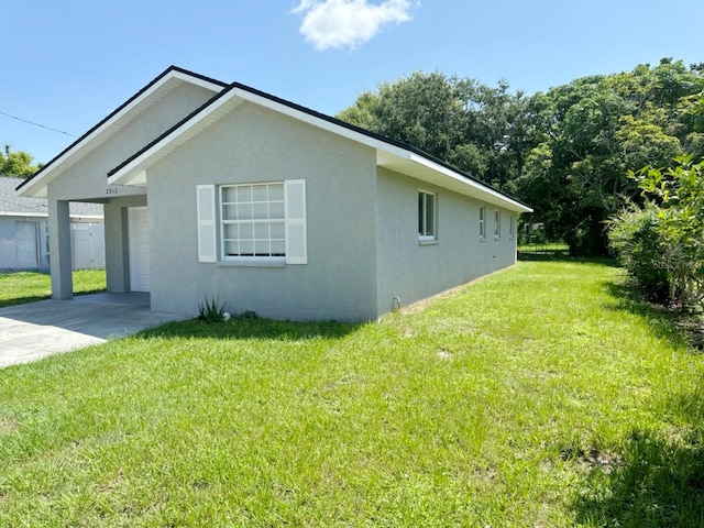 view of home's exterior with a yard