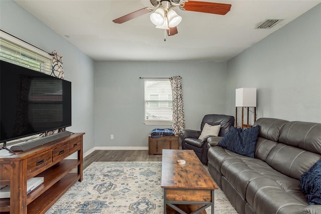 living room featuring ceiling fan and wood-type flooring