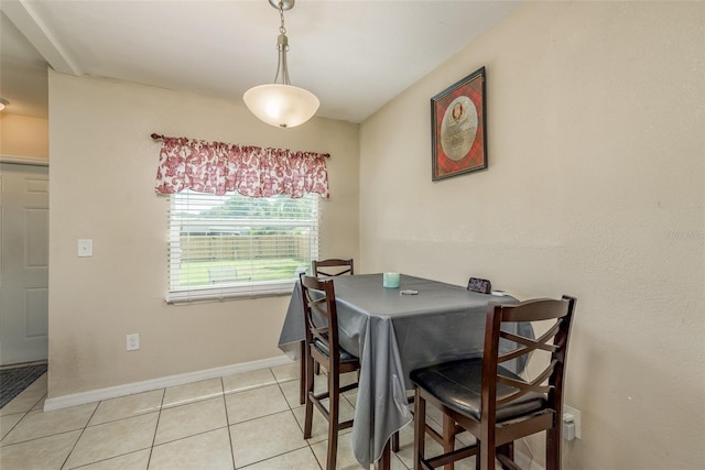 dining space featuring light tile patterned flooring