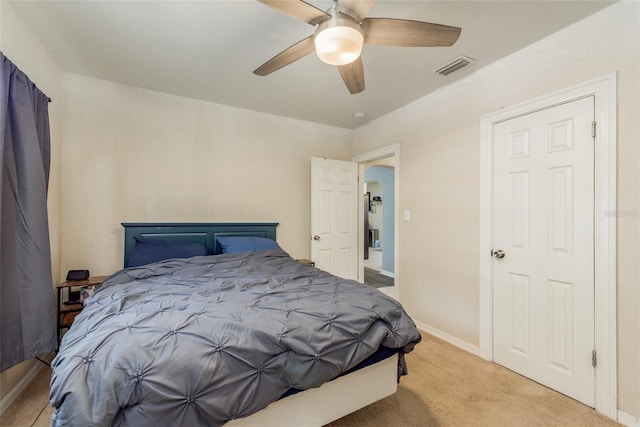 bedroom featuring ceiling fan and light carpet