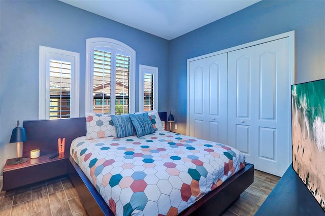 bedroom featuring a closet and dark hardwood / wood-style flooring