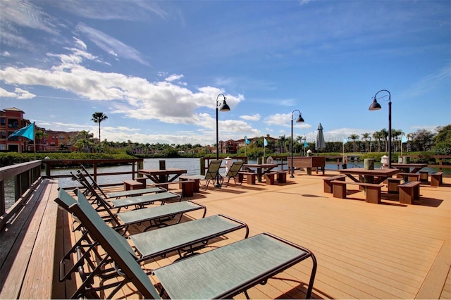 wooden deck with a water view