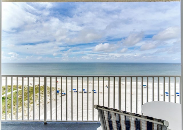 balcony with a view of the beach and a water view