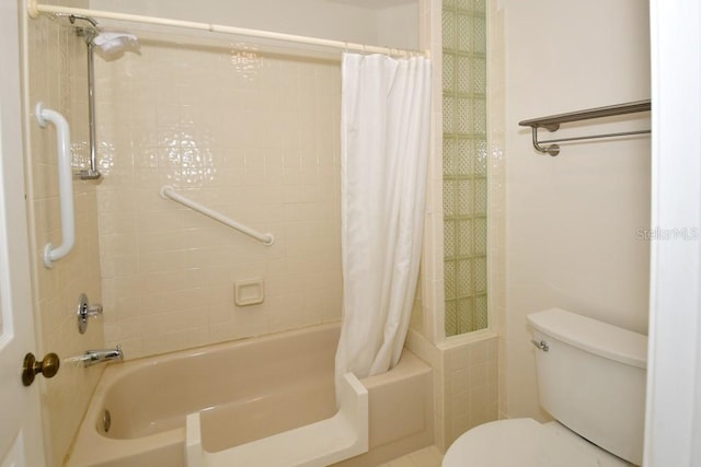 full bathroom featuring toilet and shower / bath combo with shower curtain