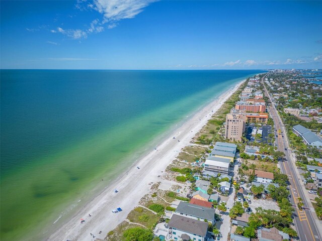 bird's eye view featuring a water view and a view of the beach