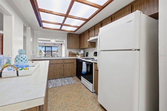 kitchen with sink and white appliances