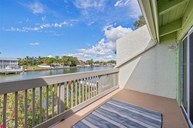 balcony featuring a water view