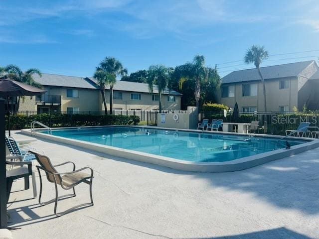 view of swimming pool featuring a patio area