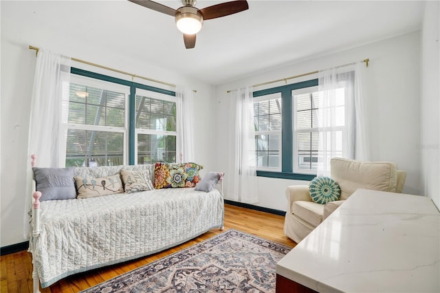 bedroom featuring ceiling fan and hardwood / wood-style floors