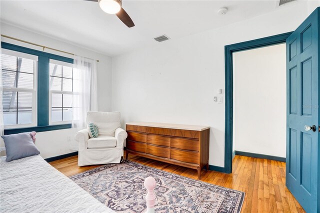 bedroom featuring ceiling fan and light hardwood / wood-style flooring