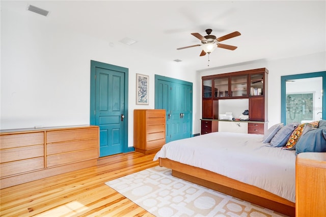 bedroom featuring light wood-type flooring and ceiling fan