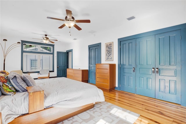 bedroom featuring light hardwood / wood-style floors and ceiling fan