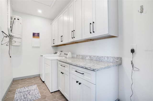 laundry area with cabinets, washer and dryer, and tile patterned floors