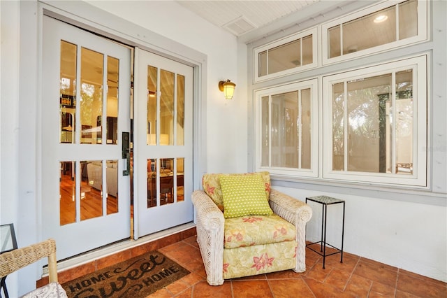 interior space featuring wood ceiling and tile patterned floors