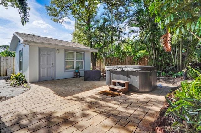 view of patio / terrace featuring a hot tub