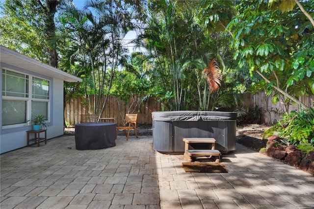 view of patio with a hot tub