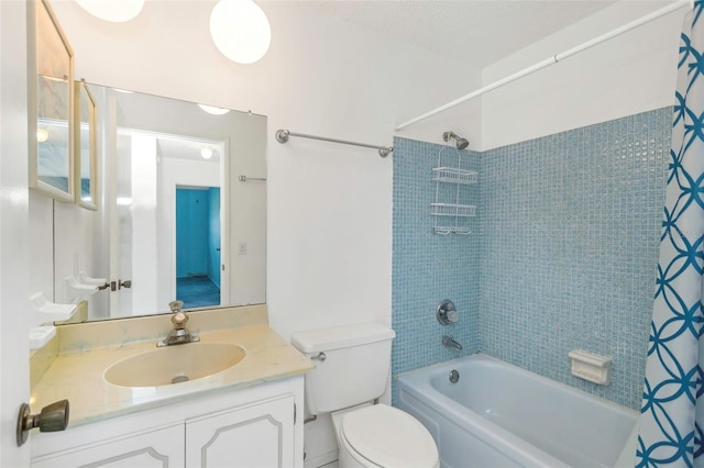 full bathroom with vanity, toilet, and shower / bath combination with curtain