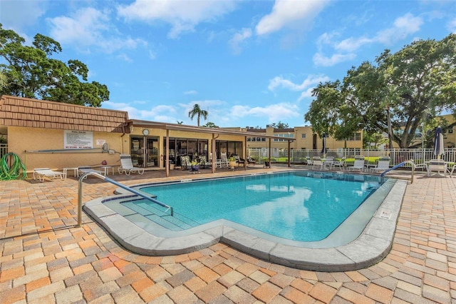 view of swimming pool featuring a patio area