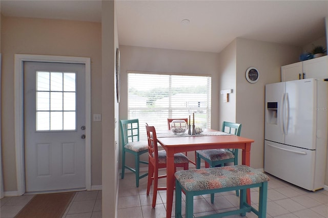 dining area featuring a healthy amount of sunlight and light tile patterned floors