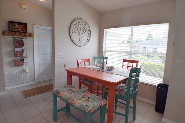 dining space featuring light tile patterned floors