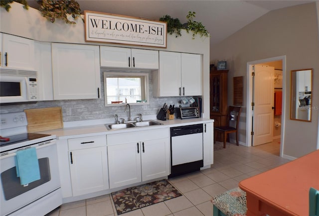 kitchen featuring sink, white appliances, white cabinets, and tasteful backsplash