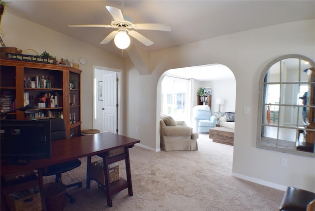 carpeted home office with ceiling fan