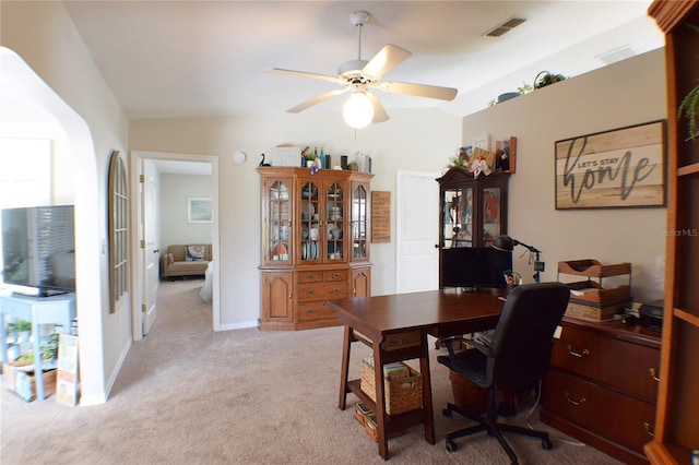 carpeted office space with lofted ceiling and ceiling fan