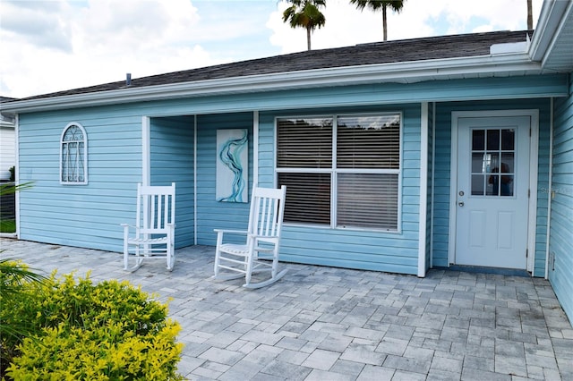 back of property with a patio