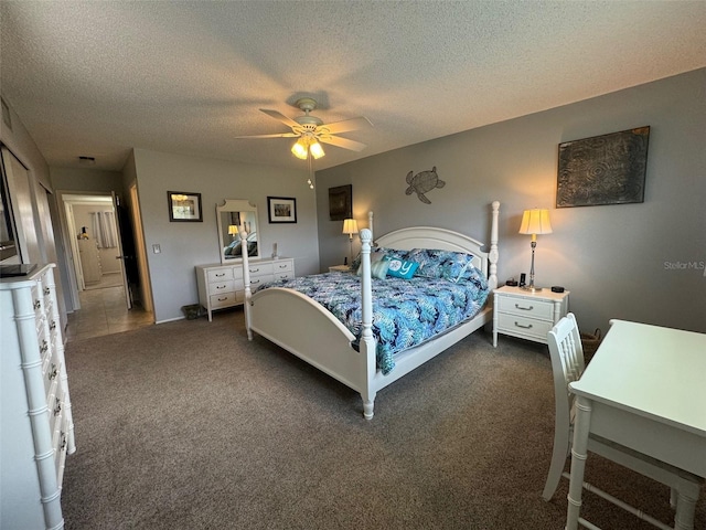 carpeted bedroom featuring a textured ceiling and ceiling fan