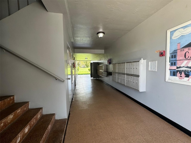 hallway featuring a mail area