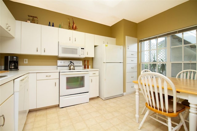 kitchen with white appliances and white cabinets