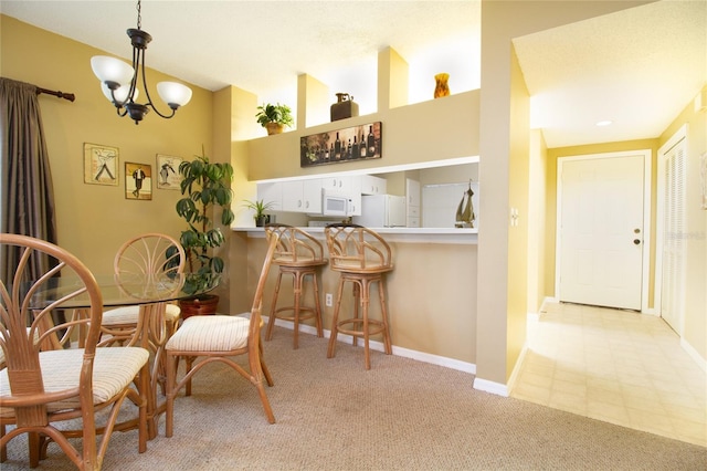 dining space featuring a notable chandelier