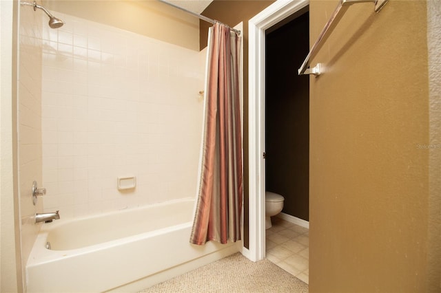 bathroom with shower / tub combo and toilet