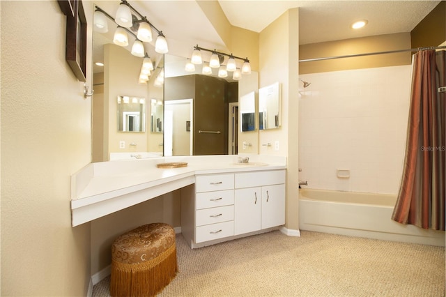 bathroom featuring shower / tub combo and vanity