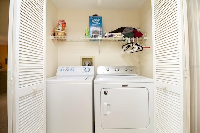 clothes washing area with independent washer and dryer