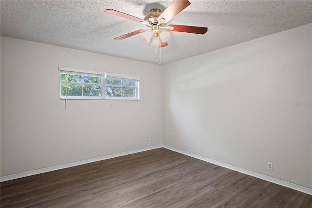 unfurnished room with dark wood-type flooring, a textured ceiling, and ceiling fan