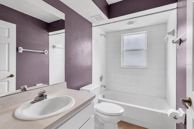 full bathroom with visible vents, toilet, tile patterned floors, tub / shower combination, and vanity