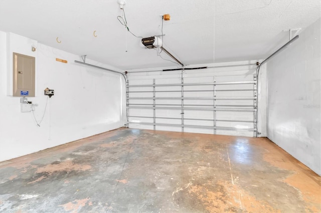 garage with electric panel and a garage door opener