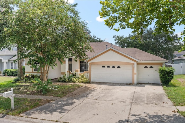 view of front of property with a garage