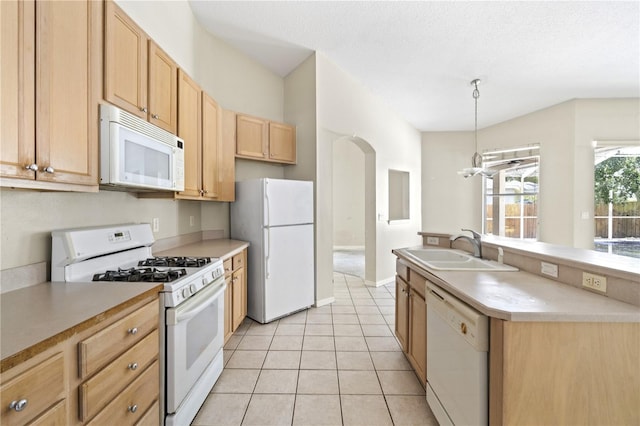 kitchen featuring hanging light fixtures, light tile patterned floors, white appliances, sink, and light brown cabinets