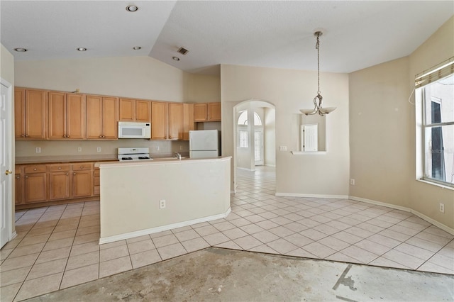 kitchen featuring vaulted ceiling, white appliances, decorative light fixtures, and light tile patterned flooring