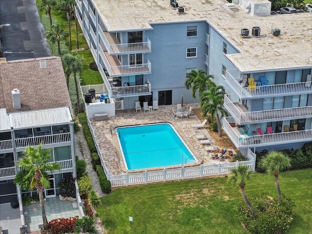 view of swimming pool with a yard and a patio area