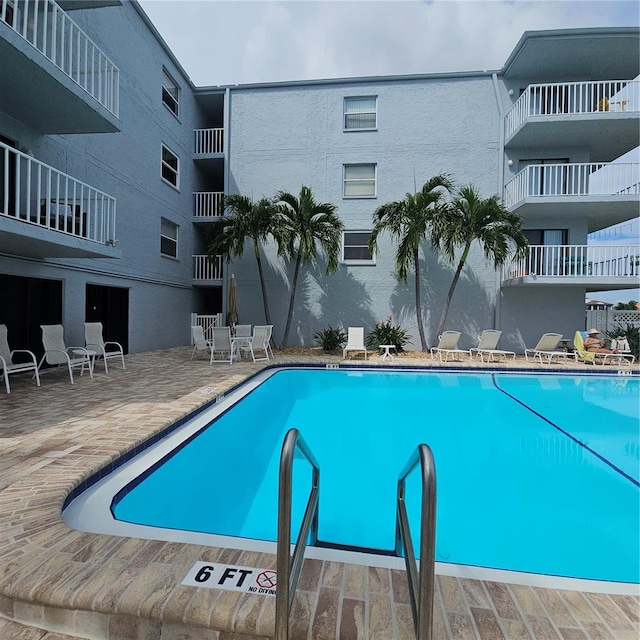 view of pool featuring a patio area