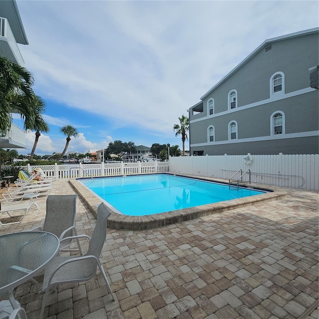 view of pool featuring a patio