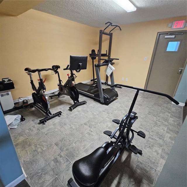 exercise area with a textured ceiling