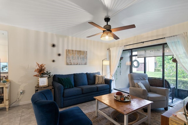 living room featuring light tile patterned floors and ceiling fan