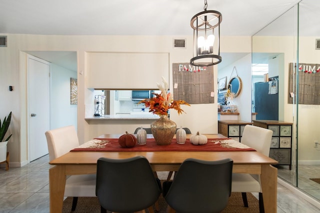 dining area featuring an inviting chandelier and a wealth of natural light