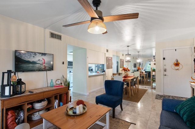 living room featuring ceiling fan and light tile patterned floors