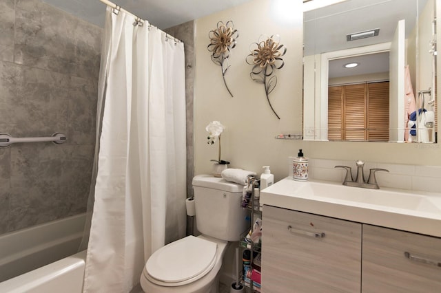 full bathroom with vanity, toilet, and shower / bath combo